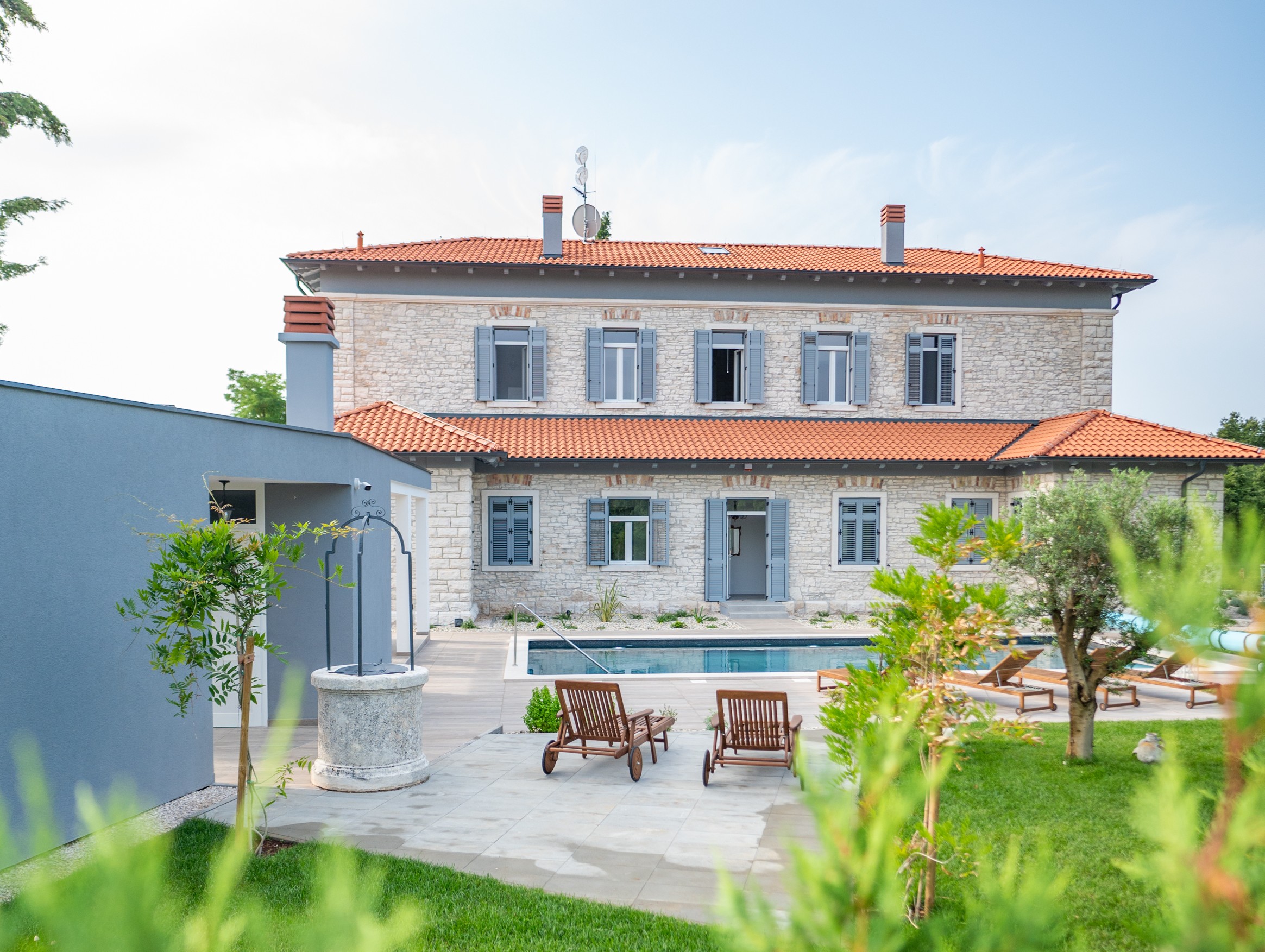Villa Scvola pool and terrace area with loungers and summer kitchen