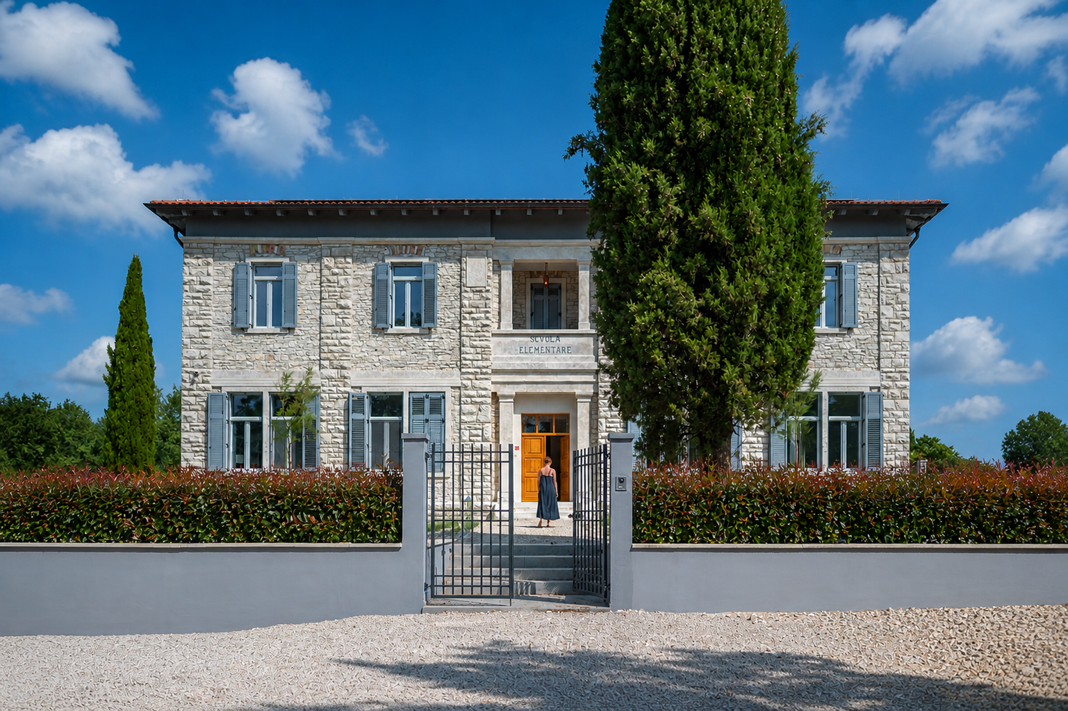 Villa Scvola Elementare exterior at dusk with illuminated pool and garden